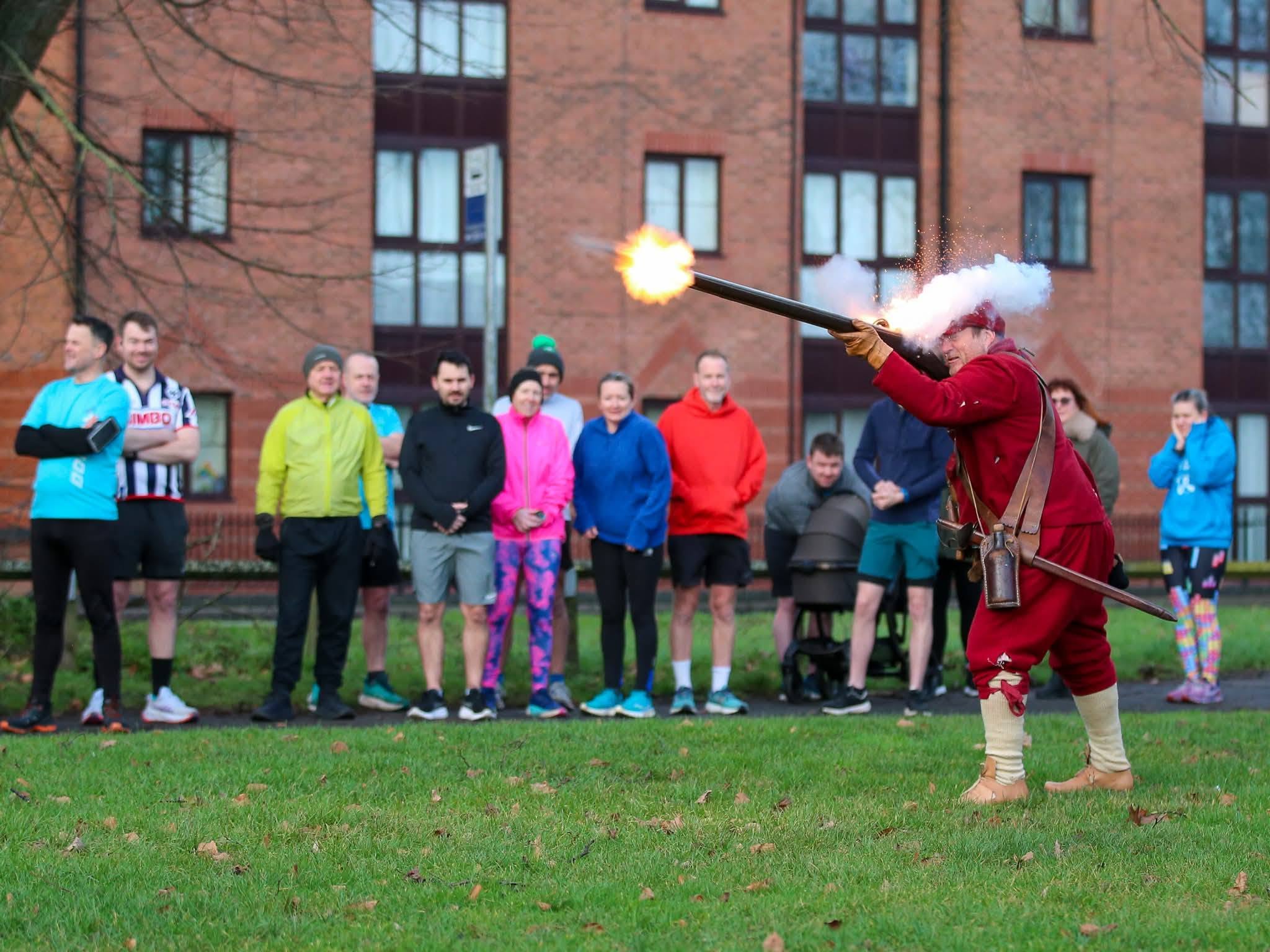 A local history reenactment beside a community gathering