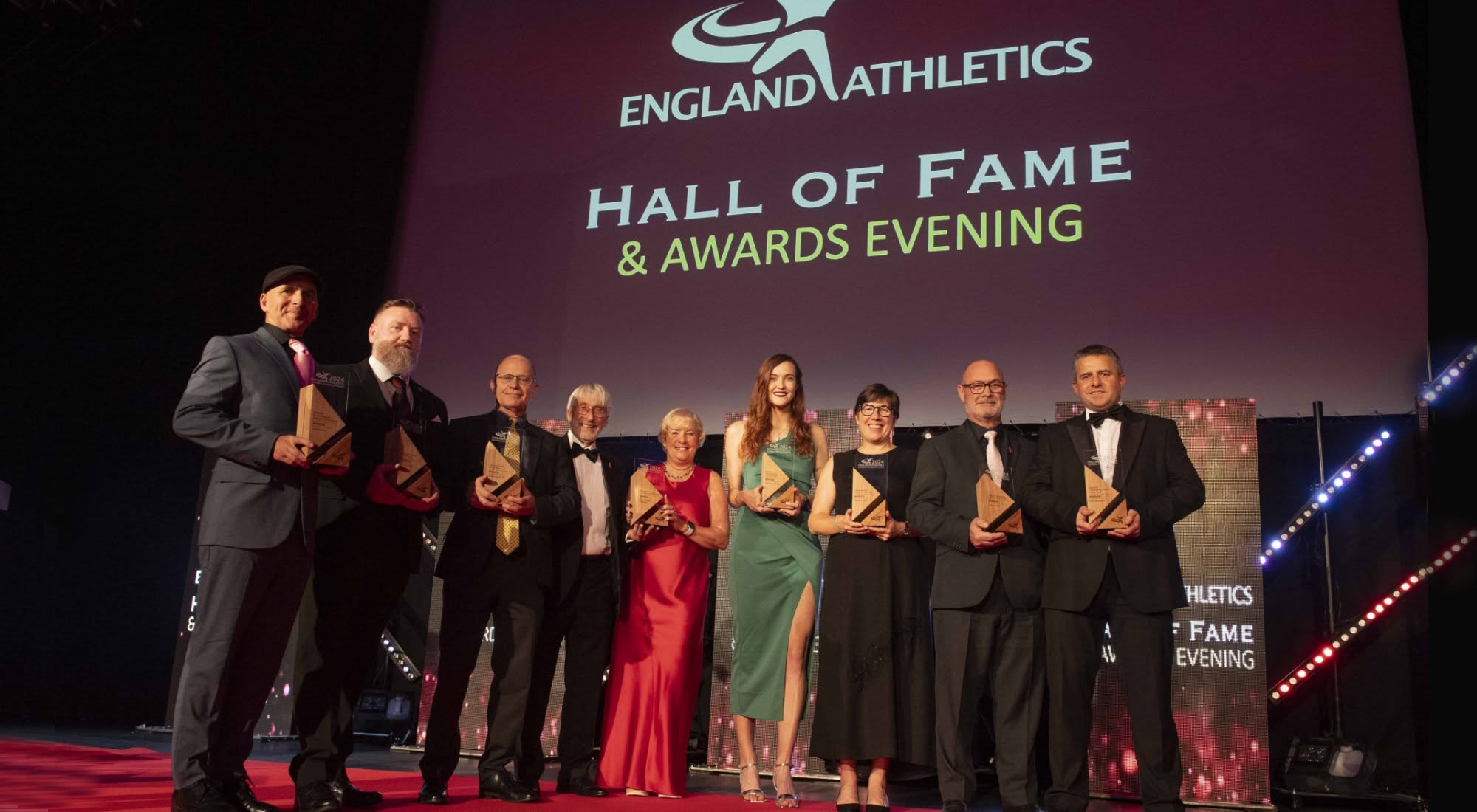 Award recipients on stage at the England Athletics Hall of Fame and Awards Evening in 2024